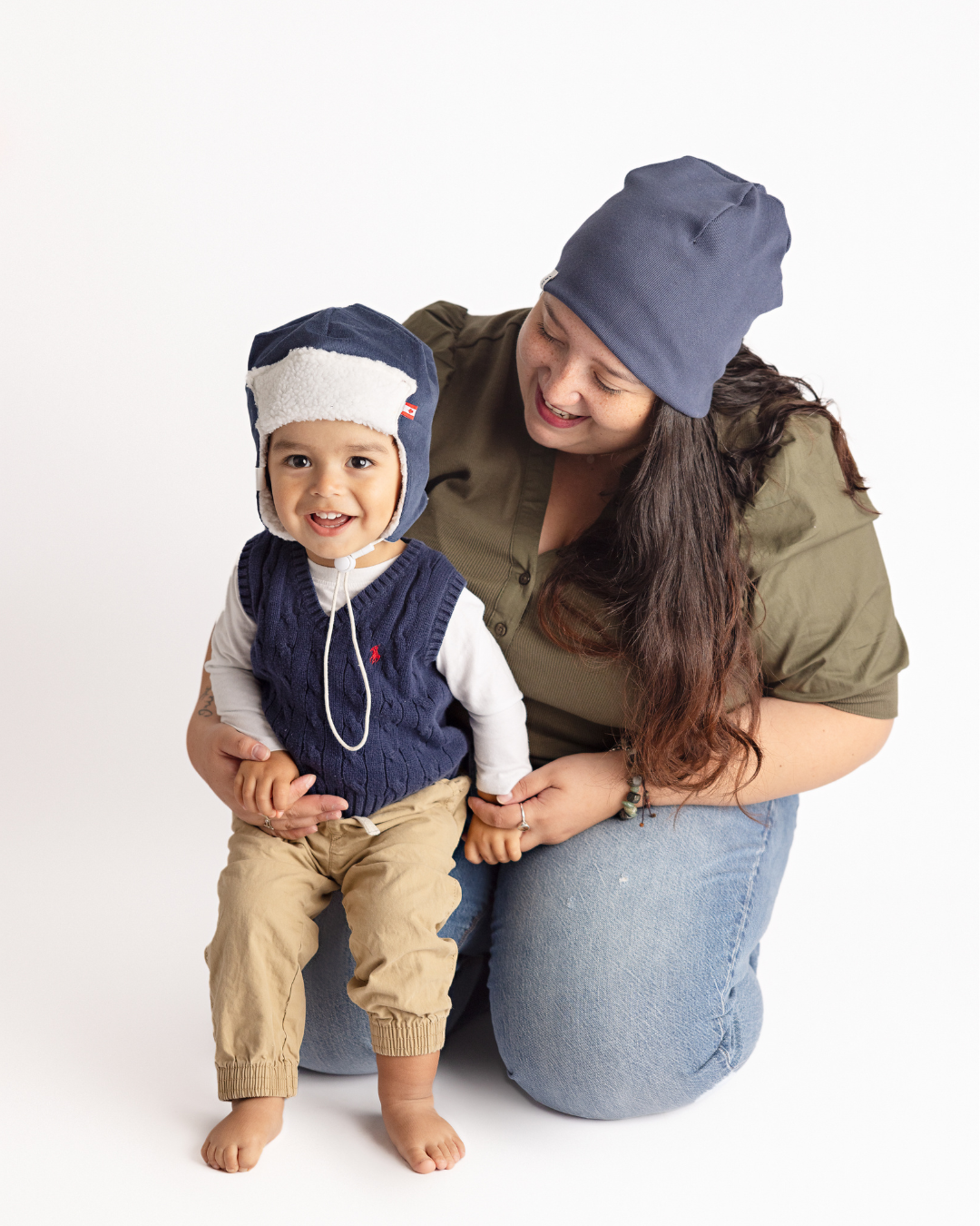Navy blue corduroy baby pilot hat with sherpa lining and chin strap, side view, Made in Canada