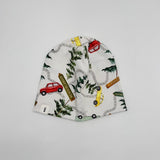 Handmade Canadian Trip beanie hat, road trip print with yellow and red cars and Atlantic Canada signs, side view