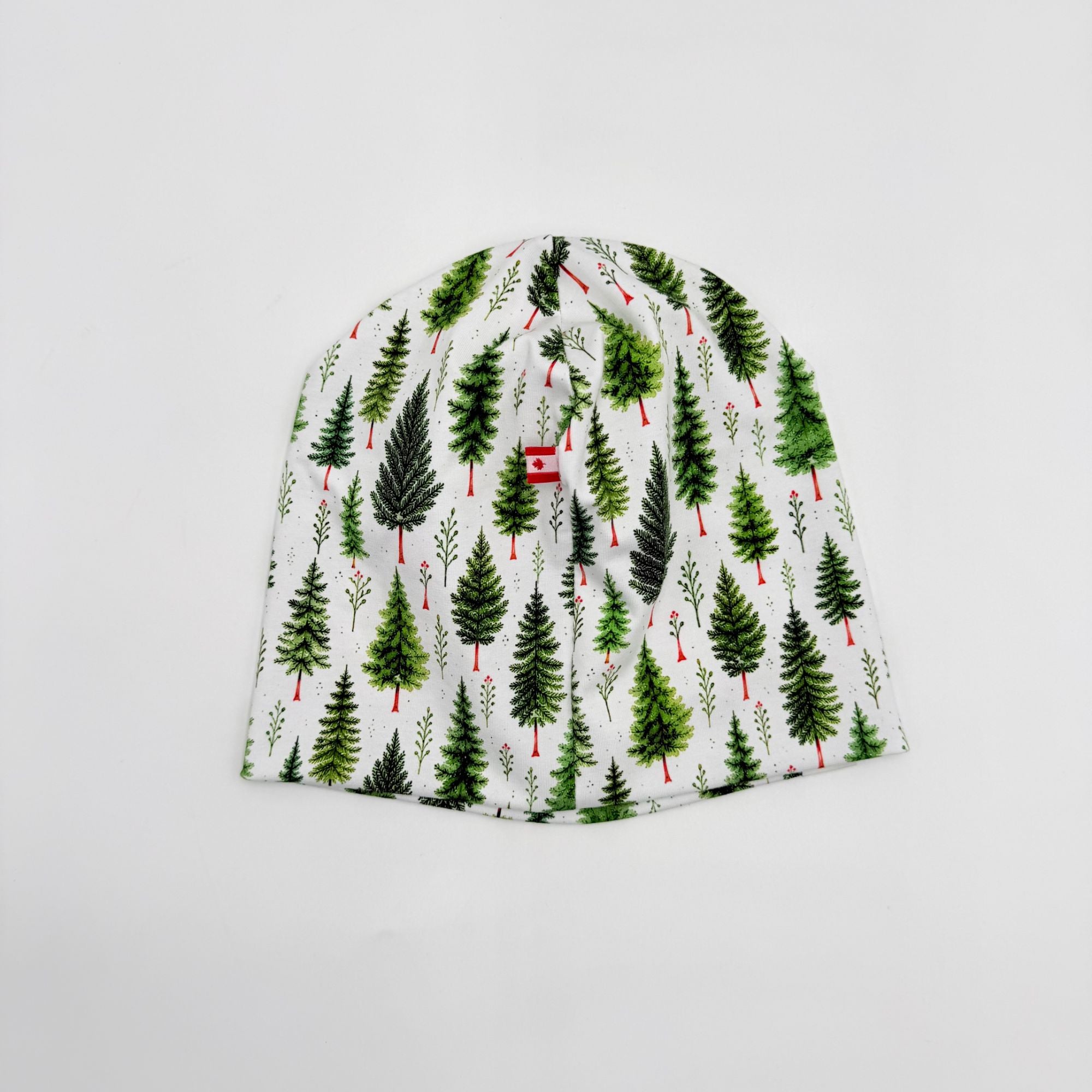 Handmade Christmas Pine beanie hat, pine tree print with Canadian flag label, back view