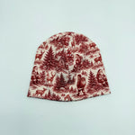 Christmas Scene baby beanie hat with Canadian flag label, red toile Santa and reindeer print, back view